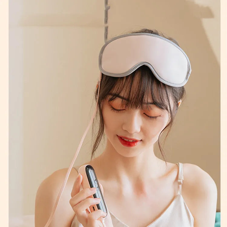Pink and green portable USB steam sleep massage goggles for eye relaxation.