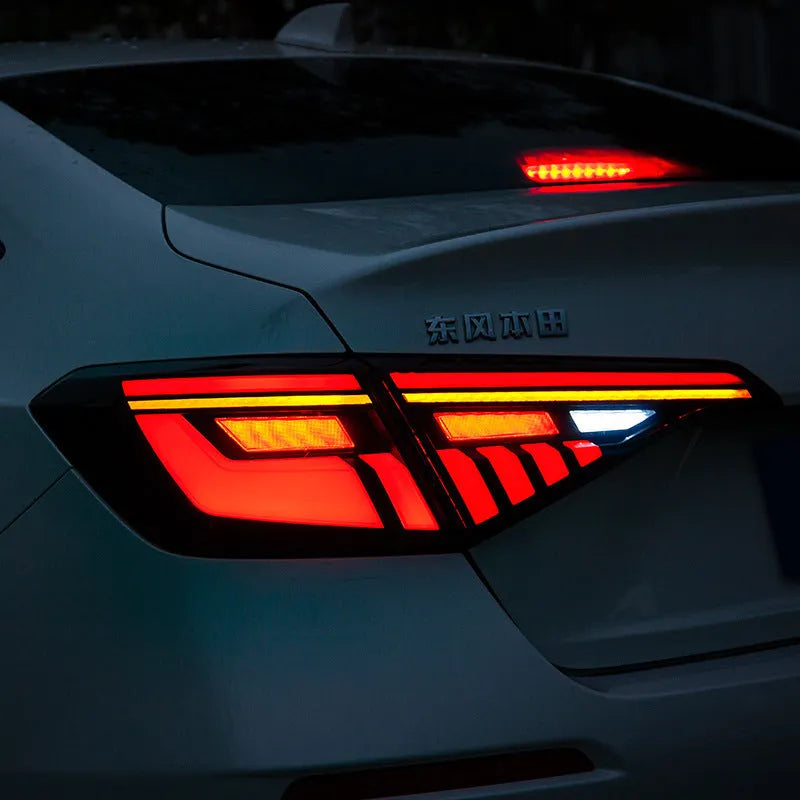 Black and red LED taillight assembly for 11th Generation Honda Civic with streamer indicators.