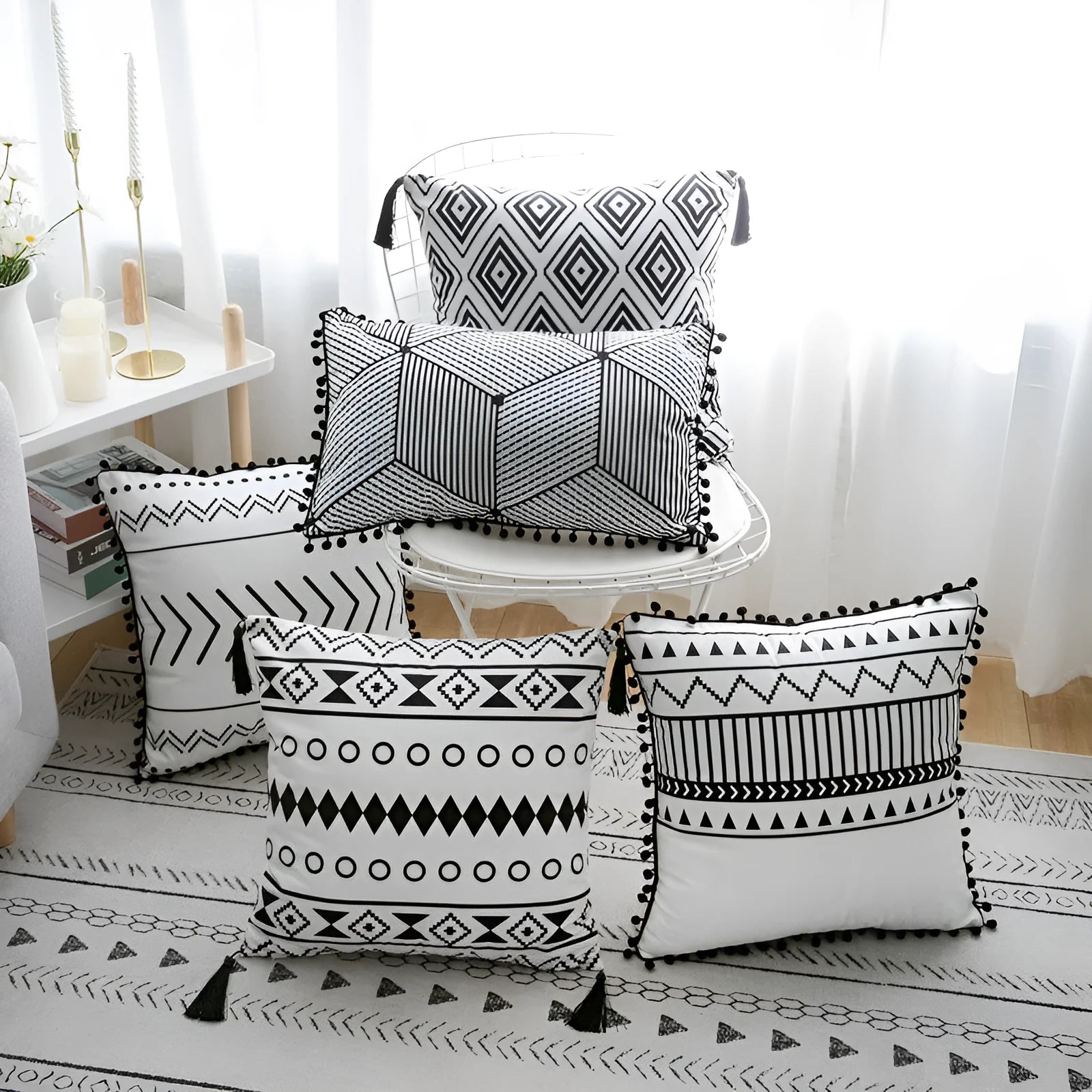 Bohemian national style throw pillow cushion cover in light grey on a sofa.