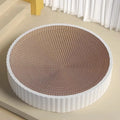 Round green cat scratching board nest with corrugated cardboard surface and two spare refills.