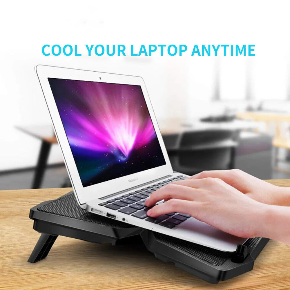 Blue computer cooling base with four LED exhaust fans and visible USB ports