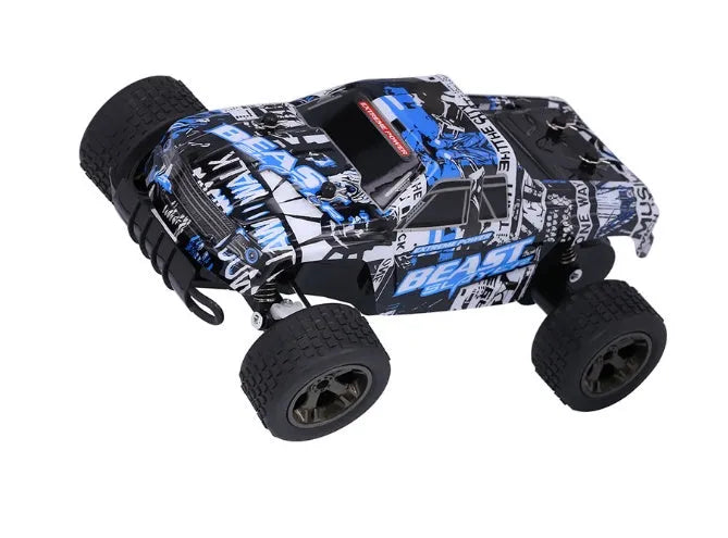 Blue 1:18 scale remote control drift car with 2.4GHz transmitter on a hard surface