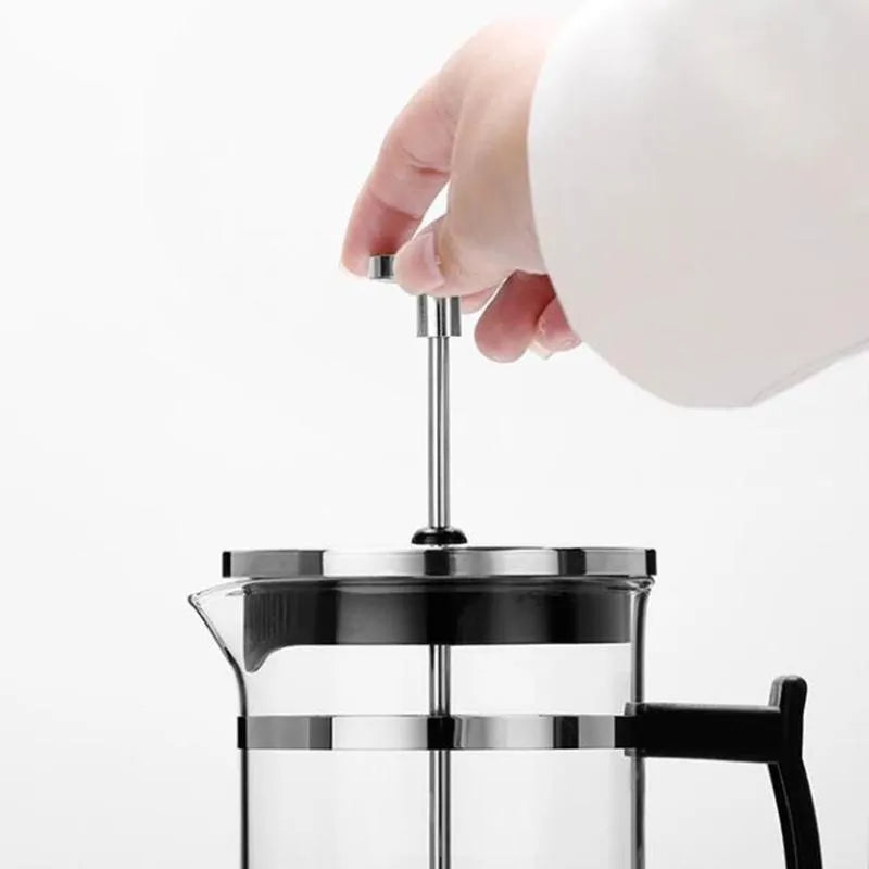 Compact 350ml capacity coffee maker made of glass and stainless steel.