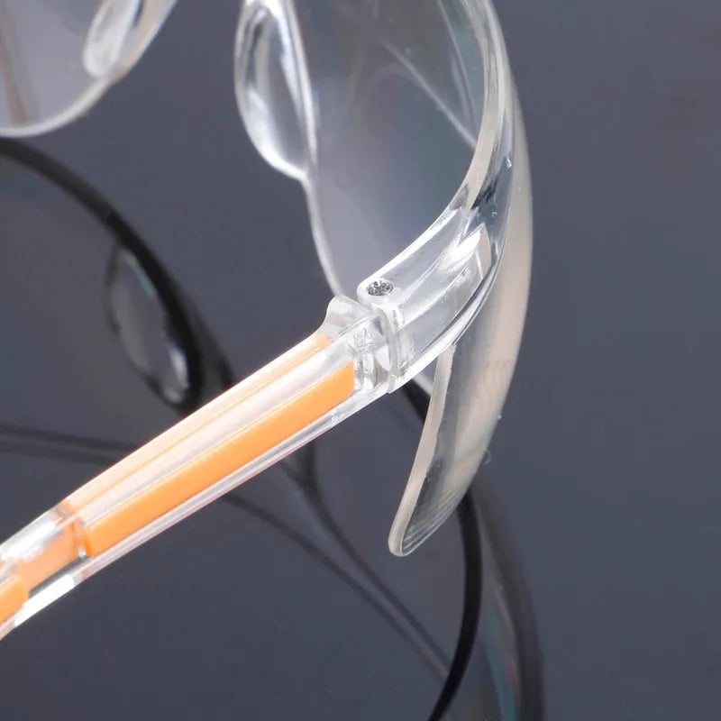 Transparent polycarbonate safety goggles with yellow tint lenses for laboratory and welding work
