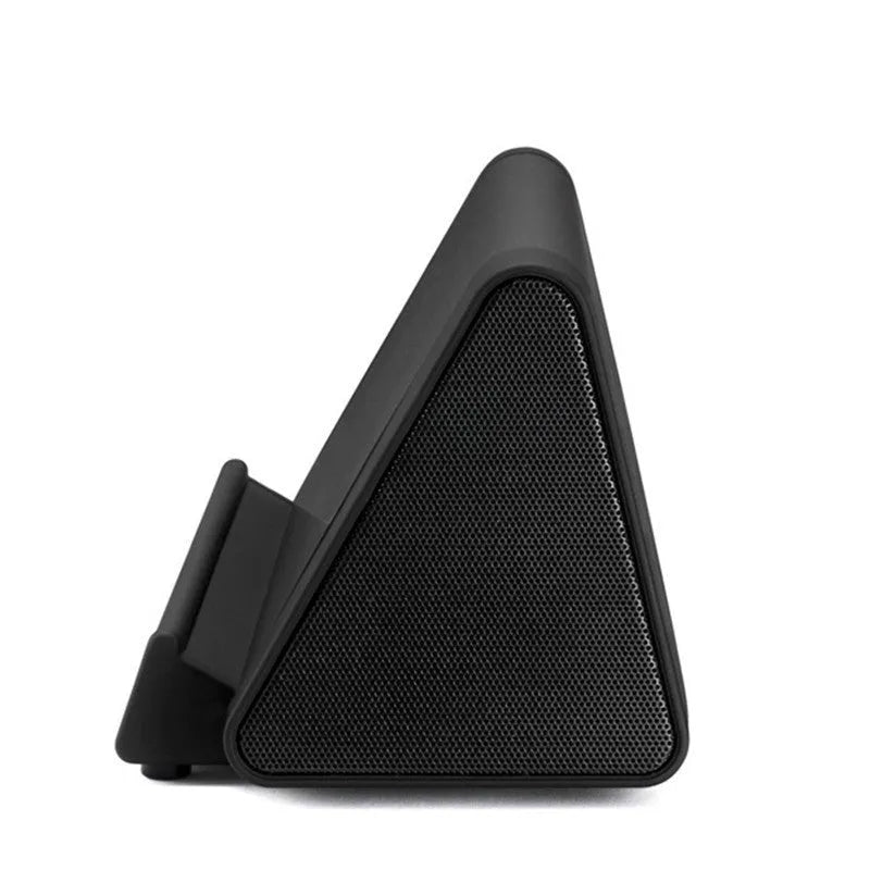 Black and white mini portable wireless Bluetooth speaker with charging cable
