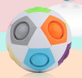 A 5.5 cm diameter rainbow-coloured plastic puzzle ball with a hexagon pattern.