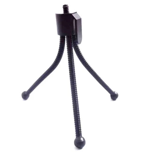 Small black iron mini tripod with ball head, shown collapsed to 110mm and extended on a desktop next to a smartphone.