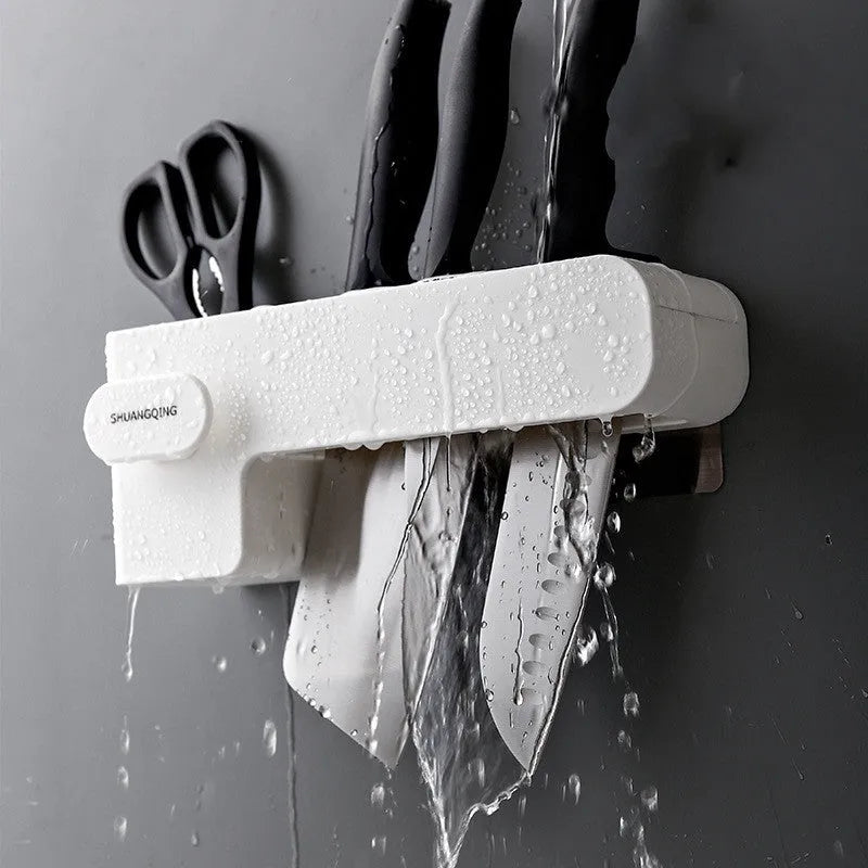 White plastic knife rack on kitchen countertop showing modern simple design