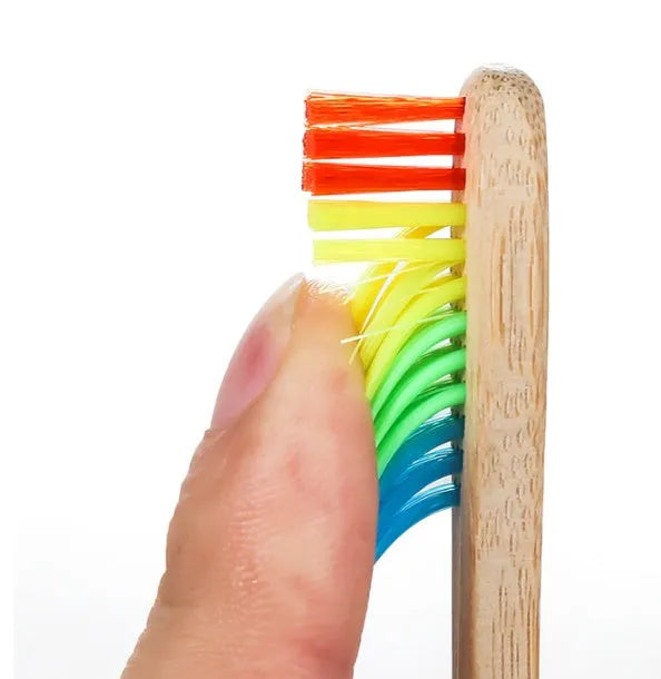 Rainbow bamboo toothbrush with natural biodegradable handle for eco-friendly oral care