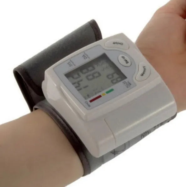 Grey wrist blood pressure monitor with compact rectangular design and display screen