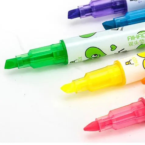 Six double-headed watercolour highlighter pens in pink, orange, yellow, green, blue, and purple colours showing plug-in design