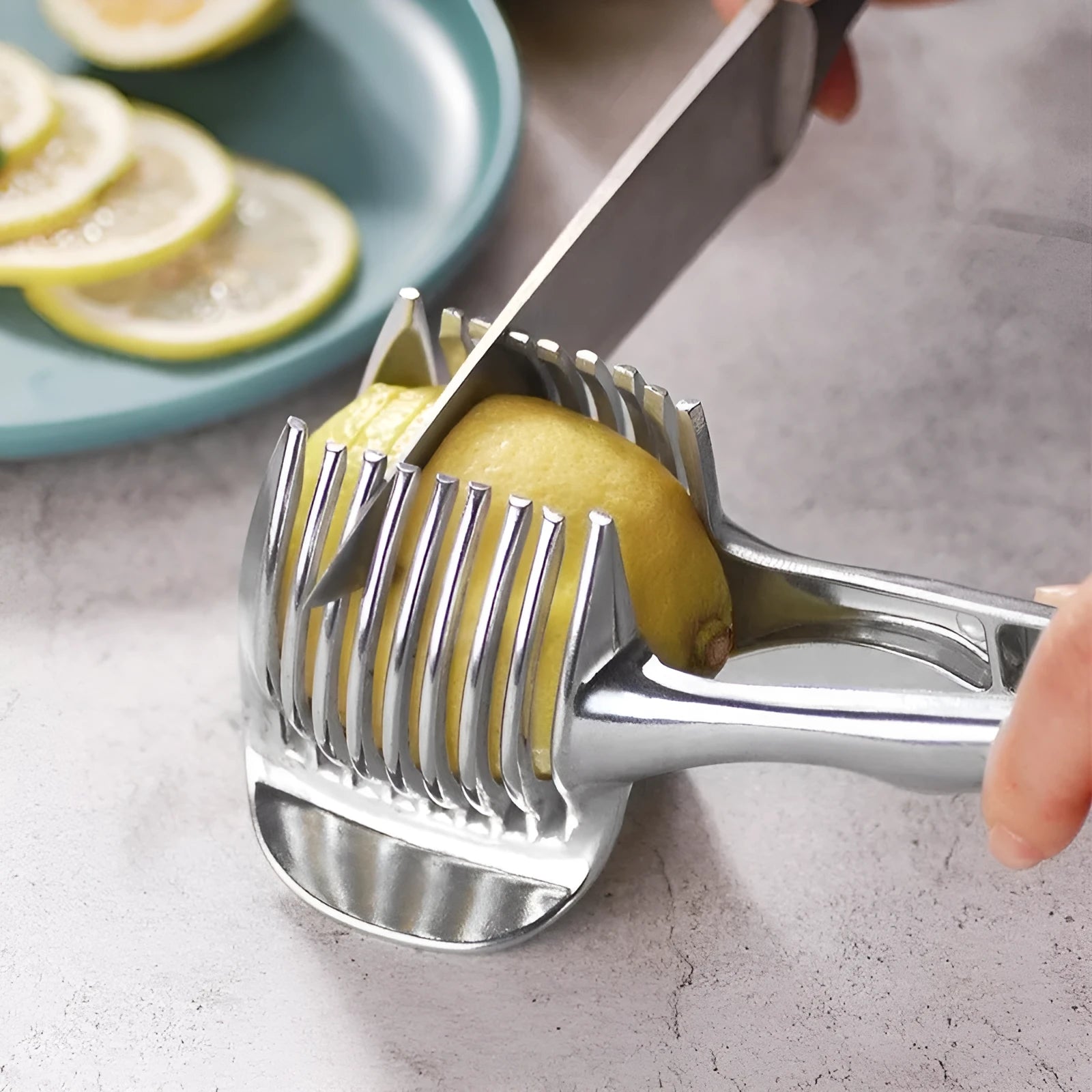 Silver plastic lemon slicer kitchen gadget for fruit and vegetable cutting