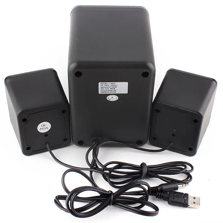 Green U-2600 2.1 USB computer speaker with colourful glowing lights on a desk
