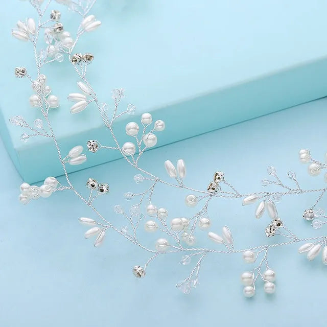 Silver bride's long hair band with crystals and pearls for wedding updos.