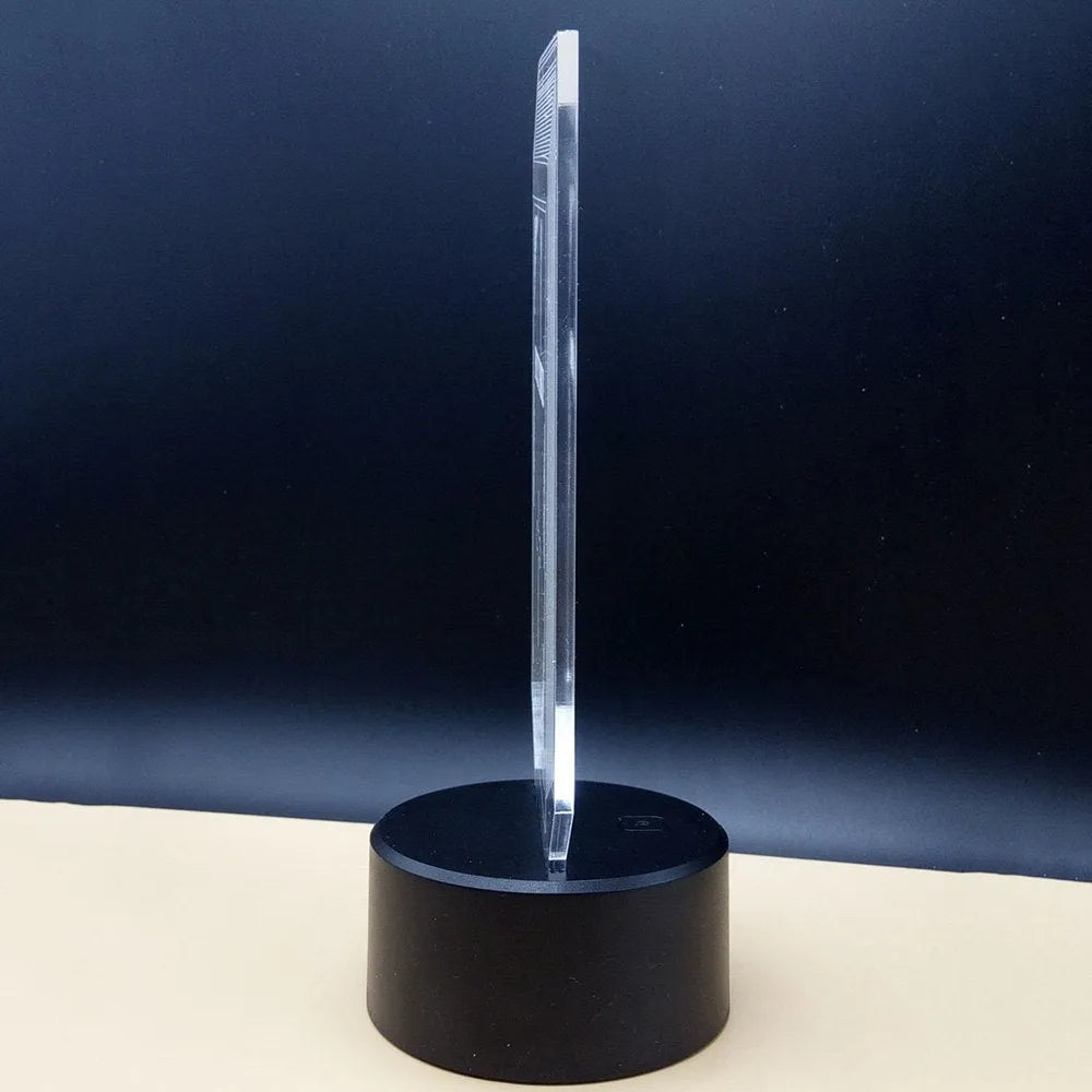 3D illusion LED desk lamp with acrylic plate on ABS base, showing remote control for colour change