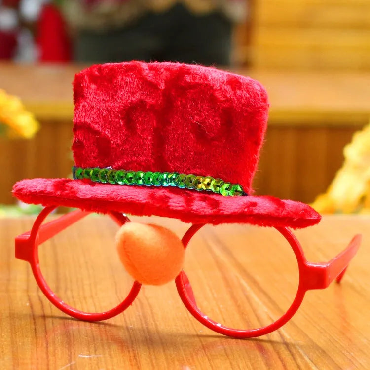 Set of four Christmas novelty glasses: Santa, Snowman, antlers, and rabbit ears designs.