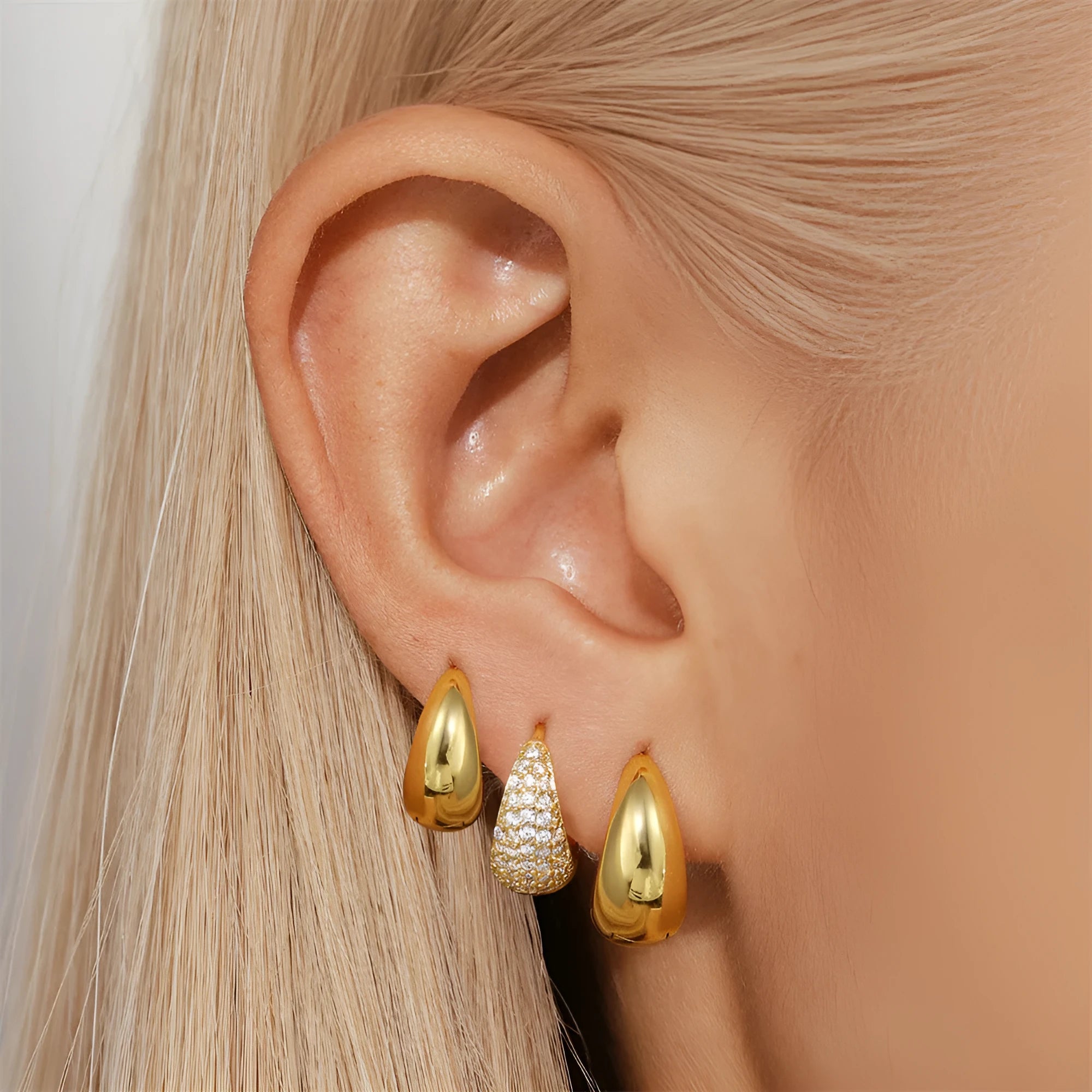 Gold tone brass diamond earclip earrings with geometric round shape and European styling