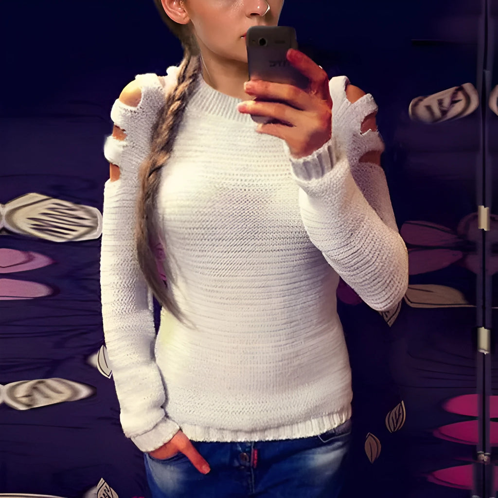 Women's grey crocheted hollow-out long sleeve knit shirt with round neckline on a mannequin