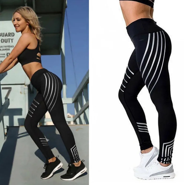 Women's black high-waisted workout leggings with night glowing print pattern on legs