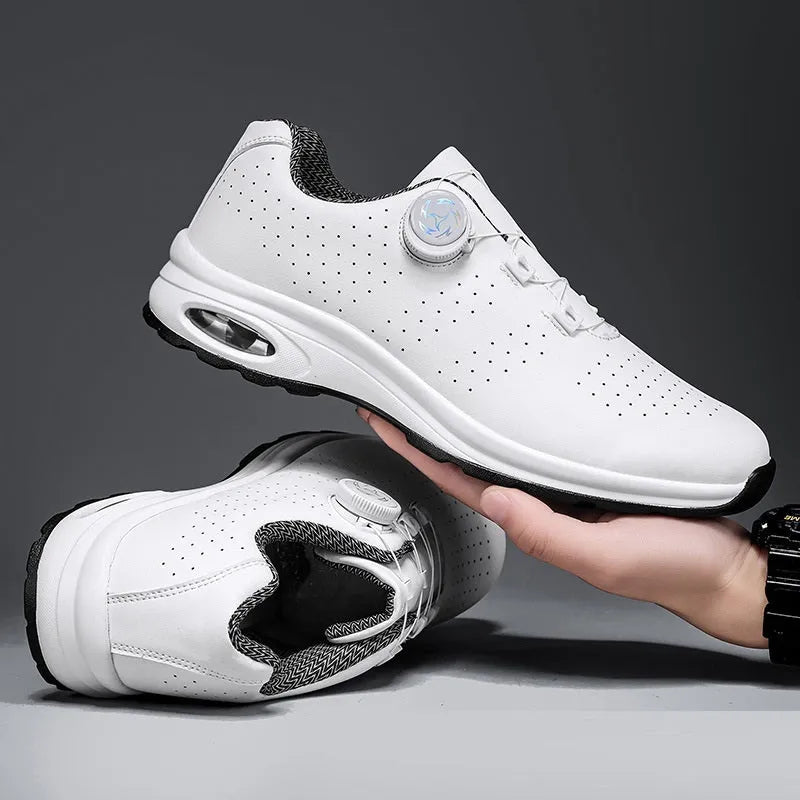 Black and white low top mesh casual shoes with lace-up front and cross shoulder straps on a composite sole.