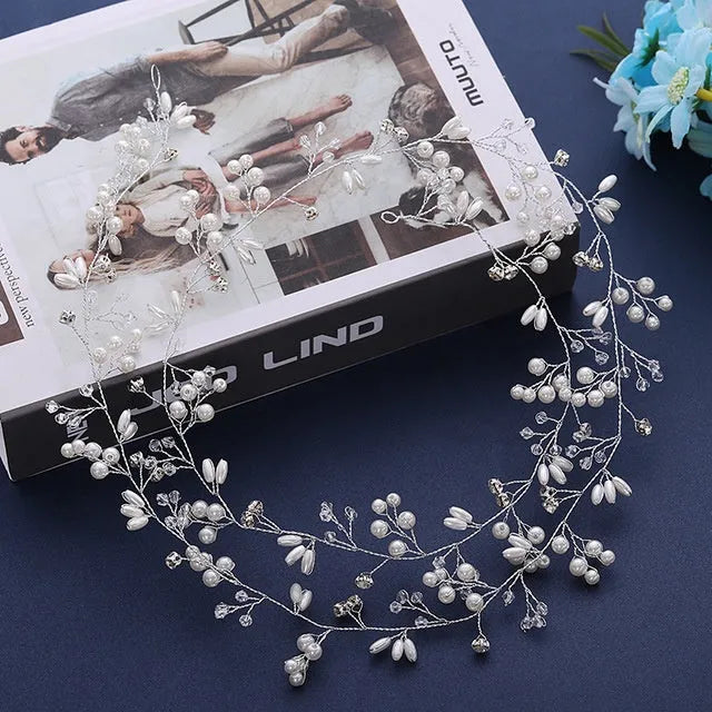Silver bride's long hair band with crystals and pearls for wedding updos.