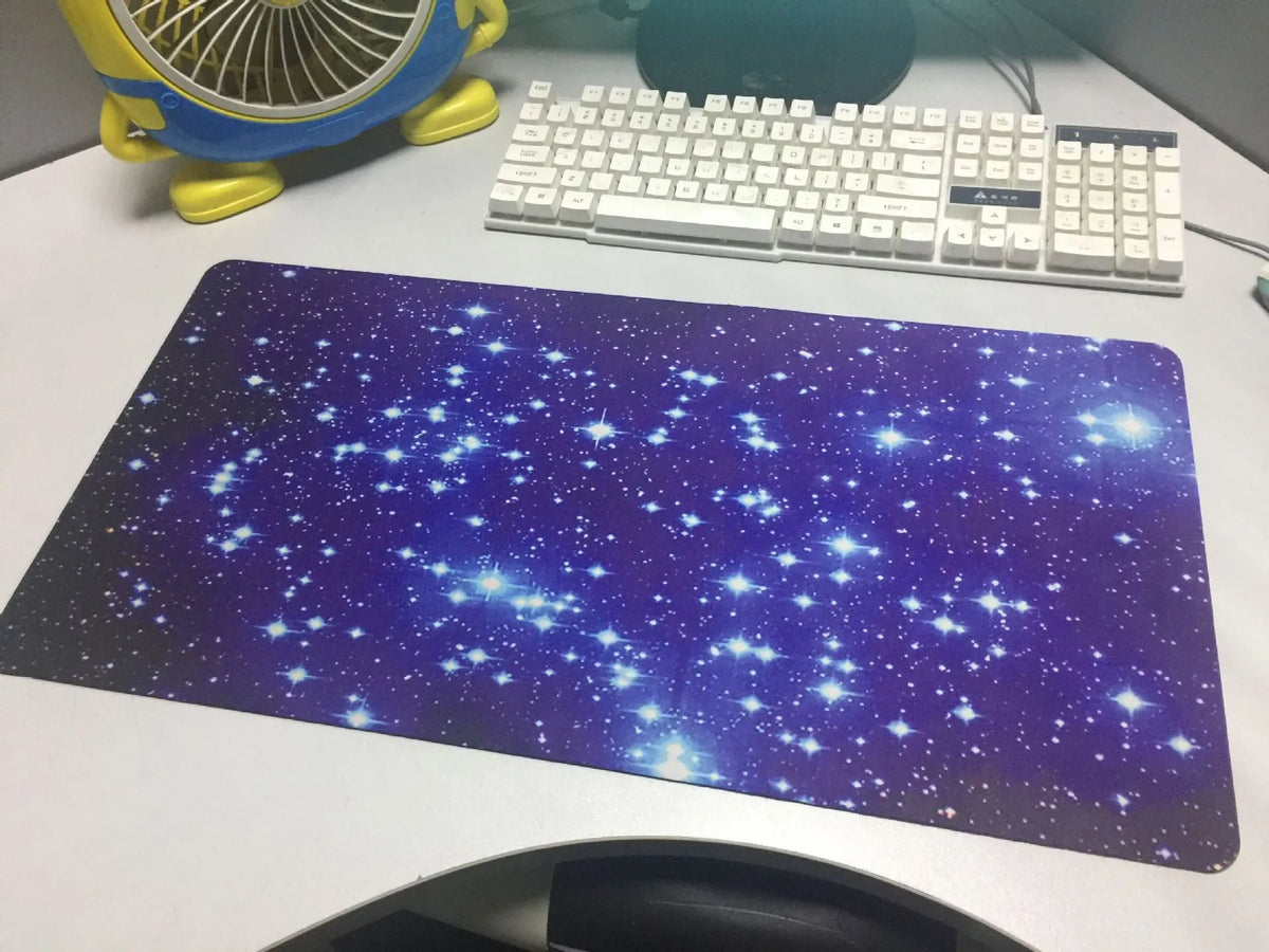 Blue star mouse pad with high-density fabric surface and natural rubber anti-skid base on a desk