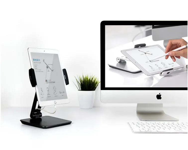 Silver foldable tablet stand showing 360-degree rotation mechanism with silicone anti-slip pads