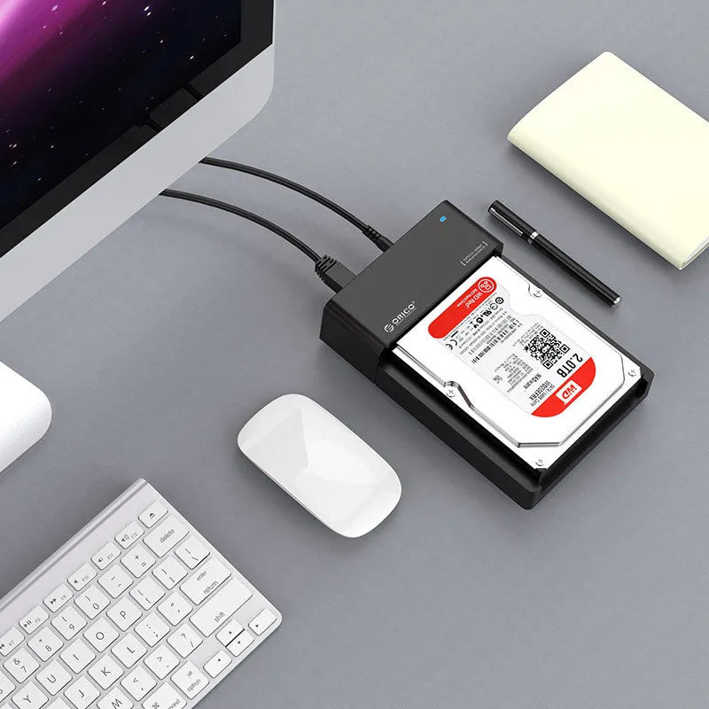 Black universal SATA hard drive enclosure for 2.5 and 3.5 inch drives with USB cable.