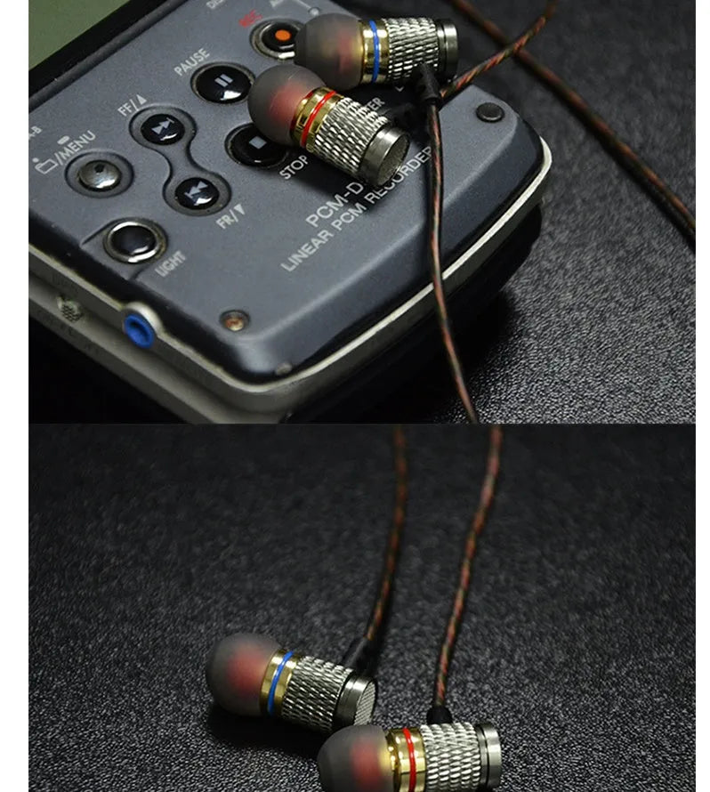 Close-up of wired in-ear headphones with metal earpiece, silicone cable, and 3.5mm L-bend plug.