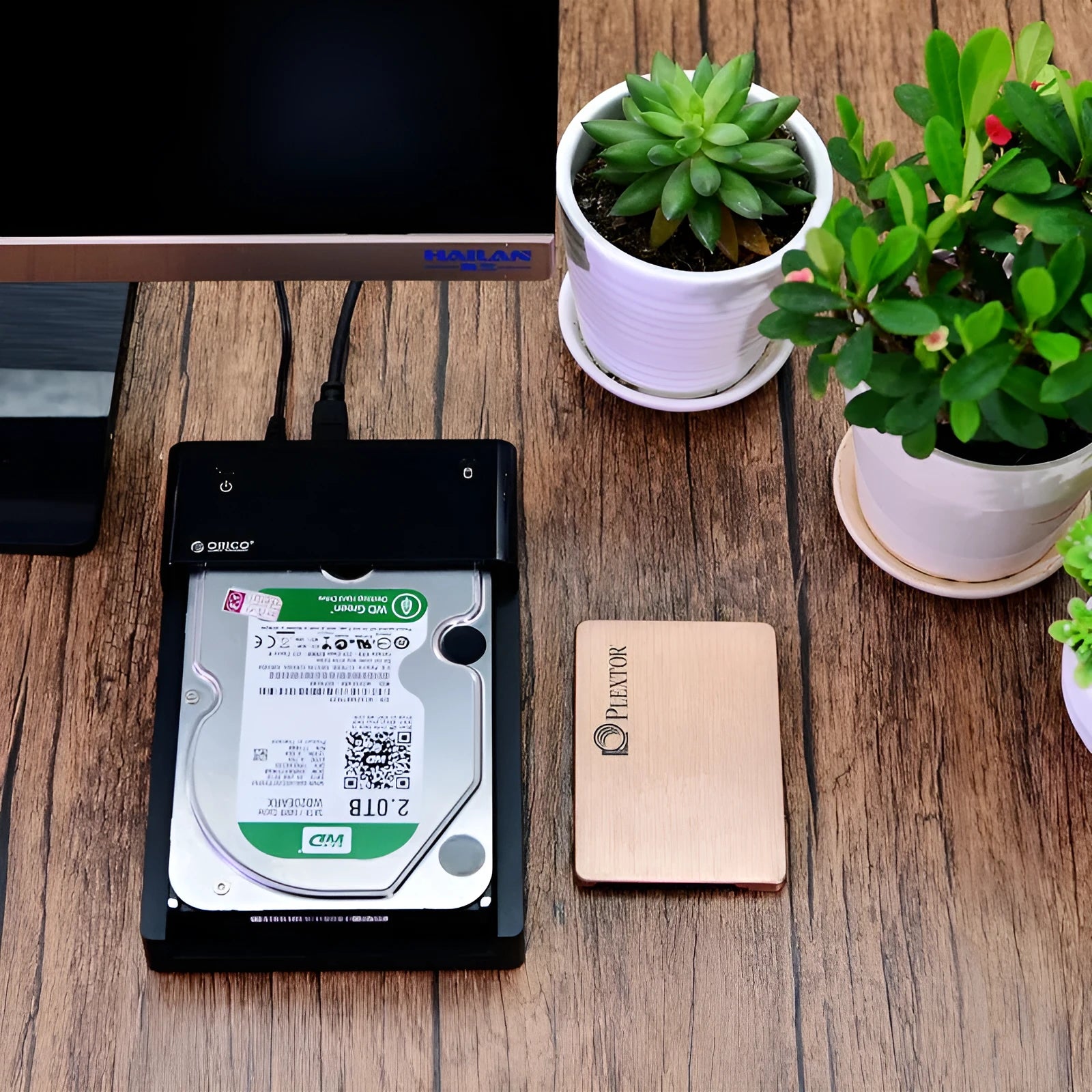 Black universal SATA hard drive enclosure for 2.5 and 3.5 inch drives with USB cable.