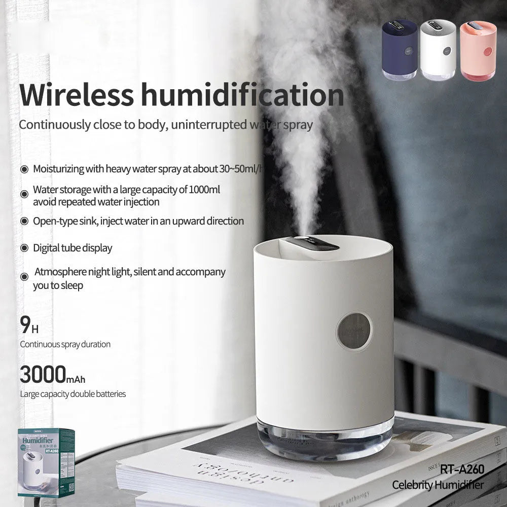 A blue wireless humidifier with a USB cable on a wooden desk.
