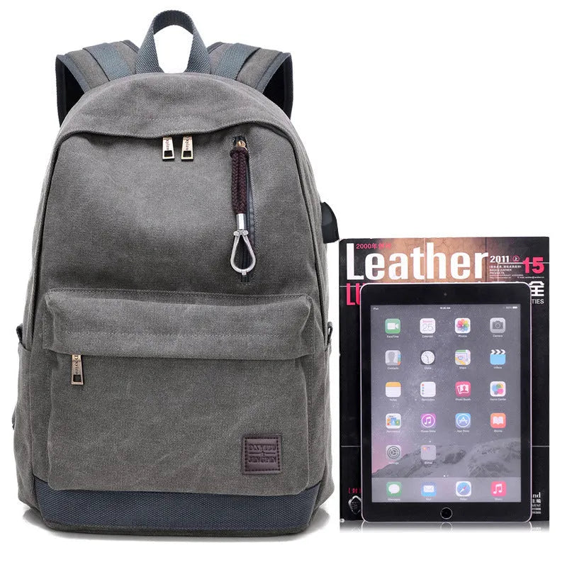 Coffee-coloured canvas backpack with USB charging port and multiple compartments.
