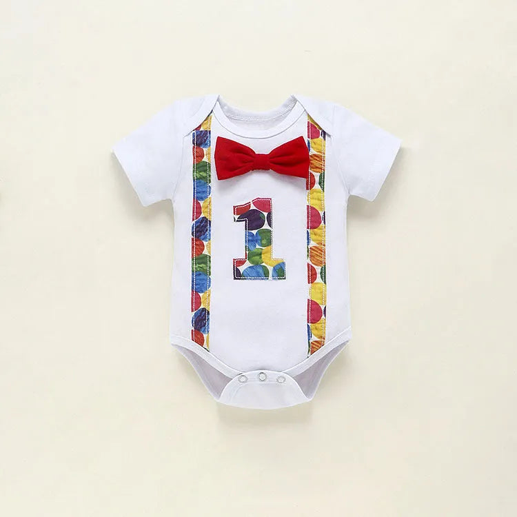 Children's blue cotton romper with shorts, bow, and dinosaur print on front