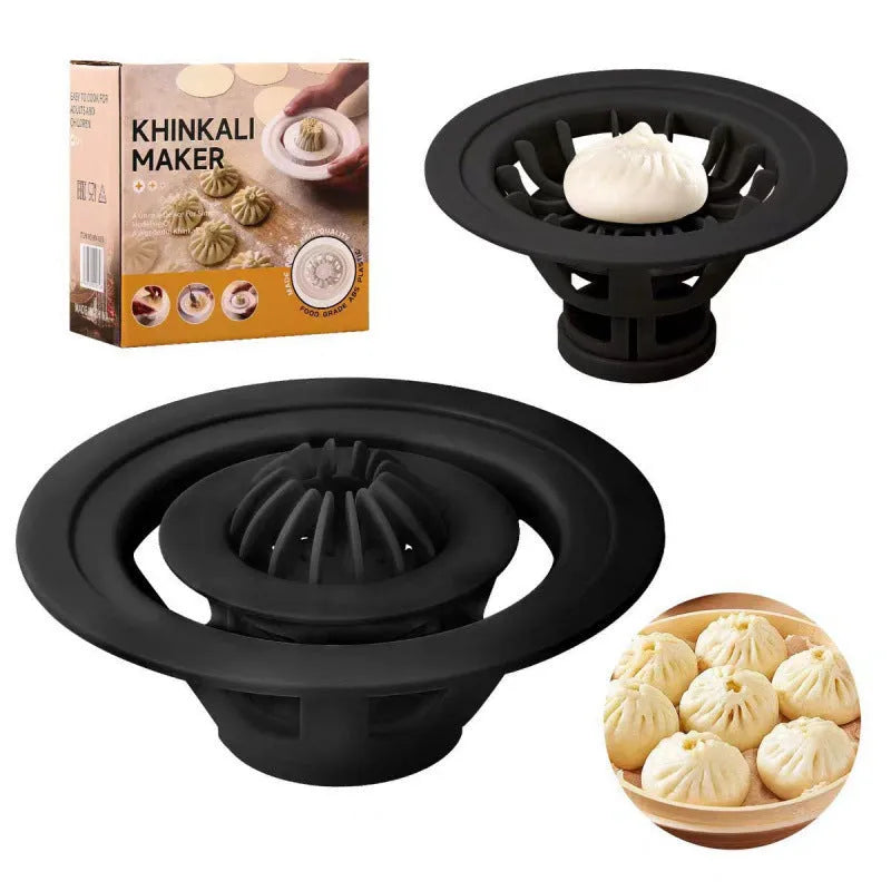 Set of four black plastic baozi and dumpling moulds for shaping steamed buns.