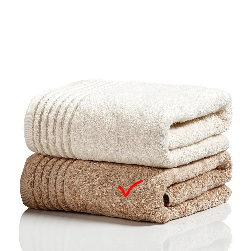 Cotton towel set in beige and brown showing three different sizes including large bath towel