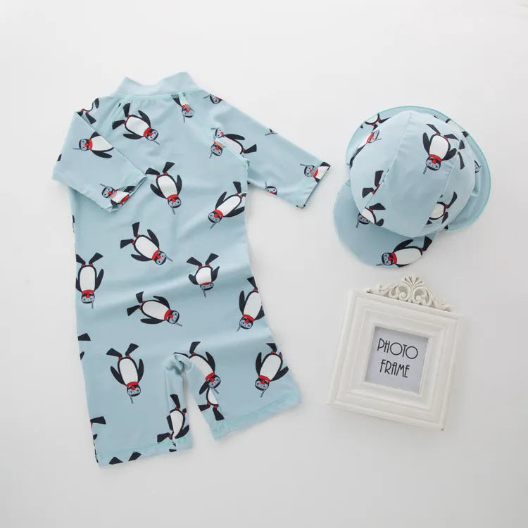 Boy's penguin print long sleeve swimsuit one-piece with matching swim cap for sun protection