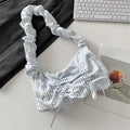 Women's polyester pleated shoulder bag with blue plaid pattern and blue bow detail, clamshell opening