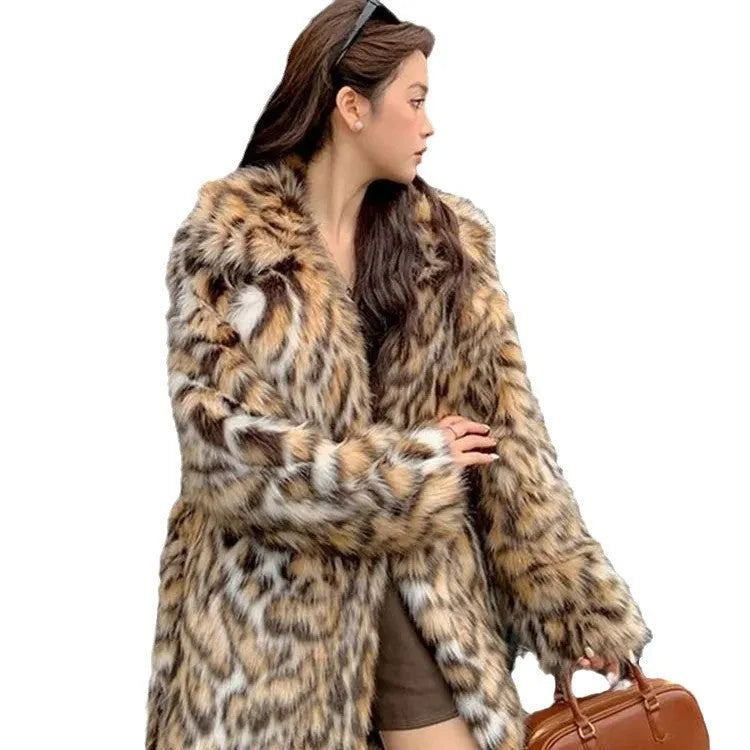 A woman's long faux fur coat with a fur collar and pockets, shown in a street fashion style.