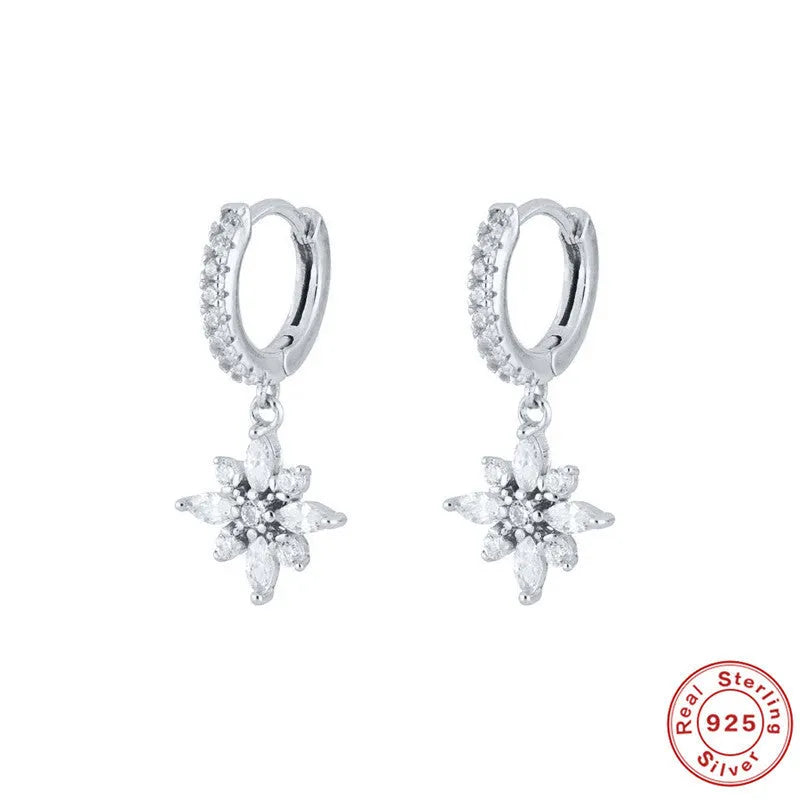 Sterling silver snowflake pendant earrings with diamond accents in geometric design