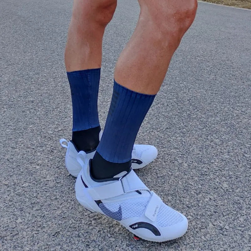Pair of athletic socks for cycling and running in a chemical fibre blend, shown in one of six available colours.