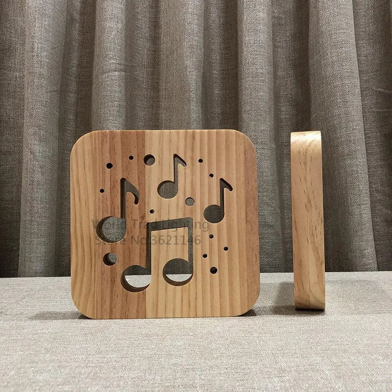 Square pine wood frame USB LED atmosphere lamp emitting warm white light on a desk.