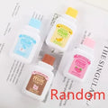 White creative correction tape dispenser shaped like a cute bottle with a curved ergonomic design