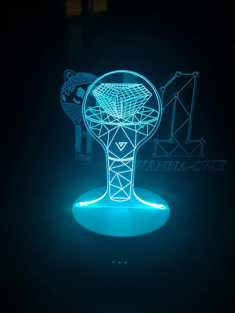 Transparent acrylic display stand showing illuminated BTS Light 101 Tower Gem collectible lamp.