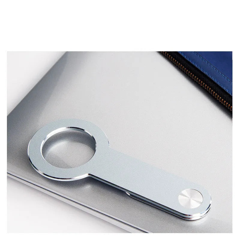 Metallic silver aluminium alloy desktop mobile phone holder with magnetic mount.