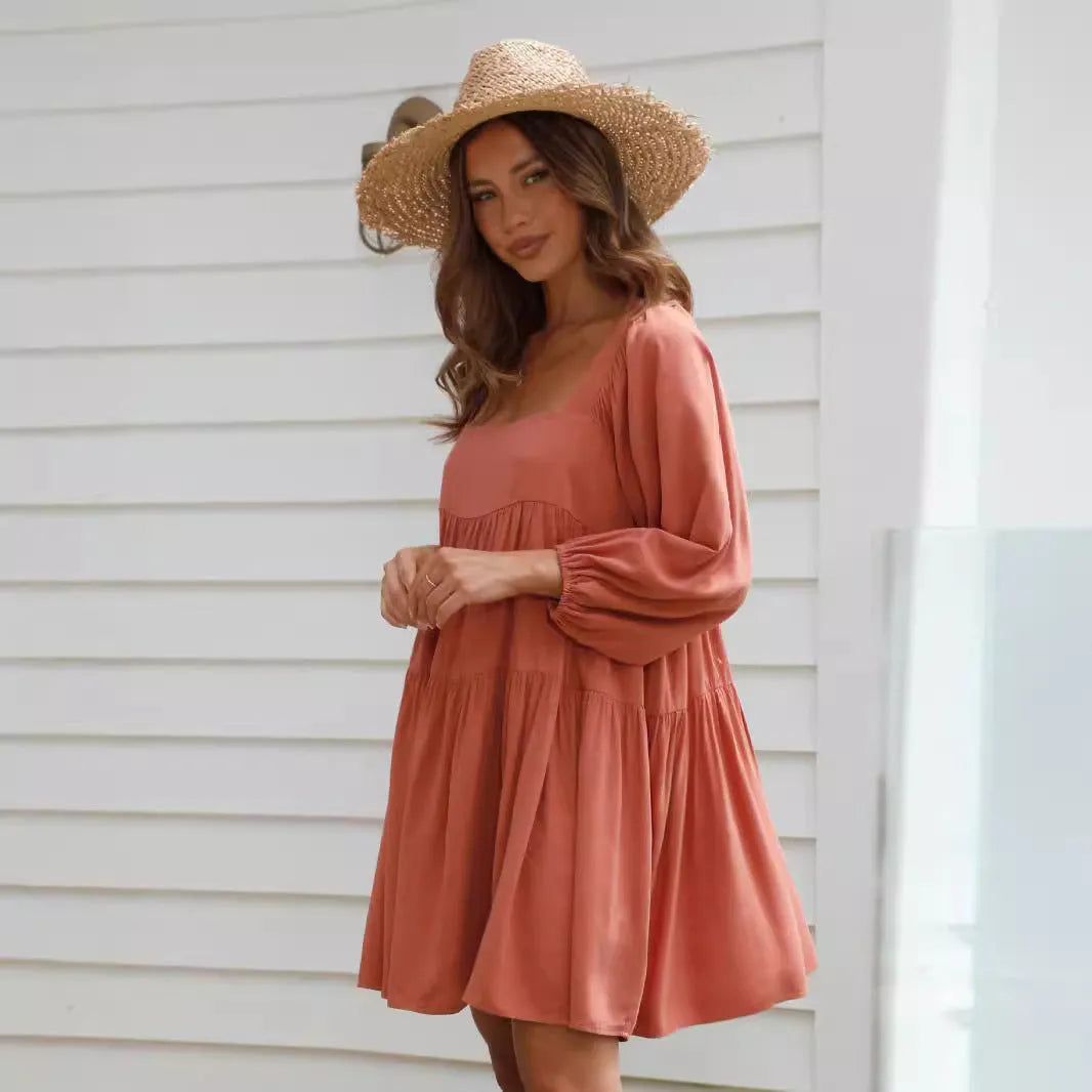 Children's solid colour pullover dress with square collar, puff sleeves, backless design, and A-line skirt.