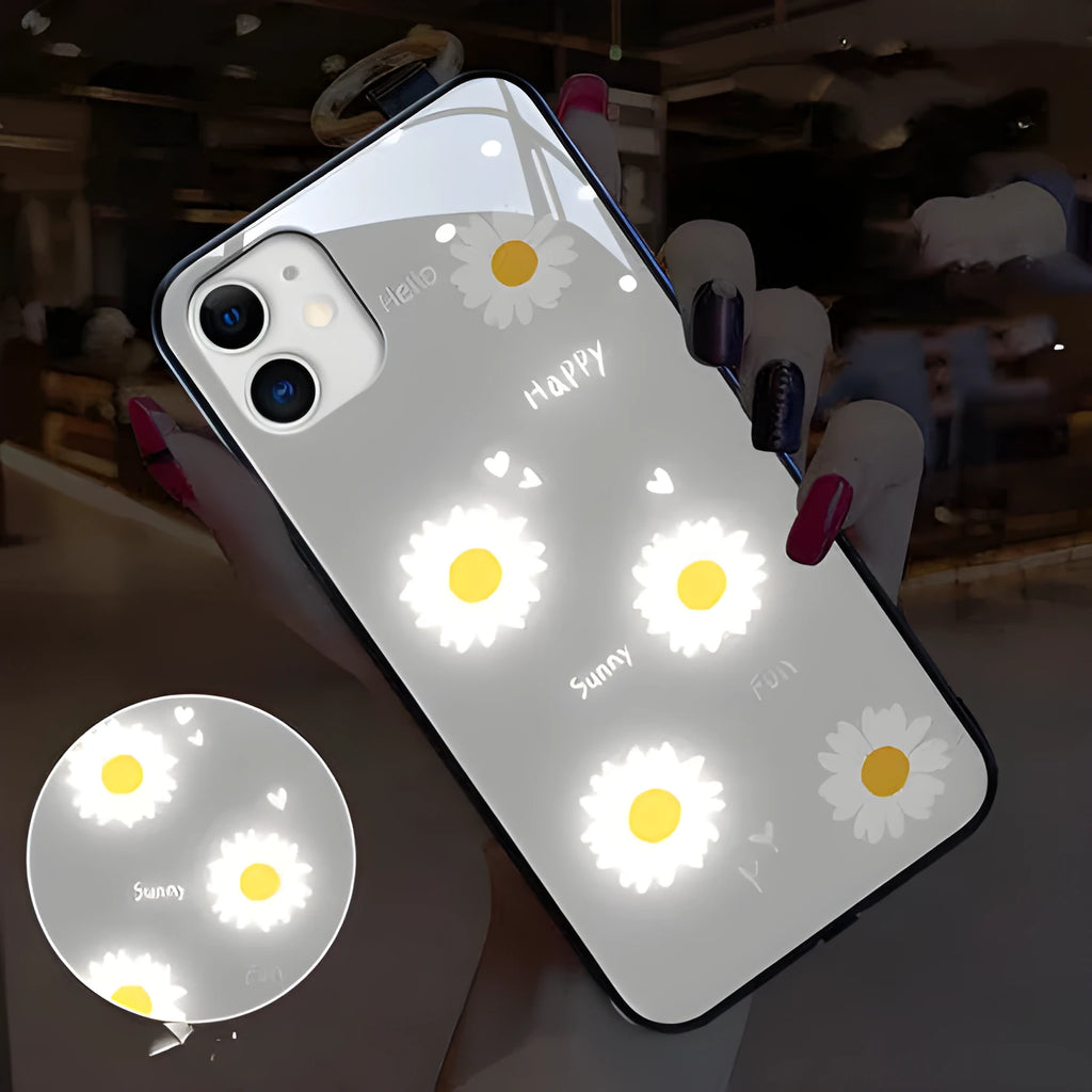 White iPhone case with painted purple daisies and voice-activated colour lights on the back.