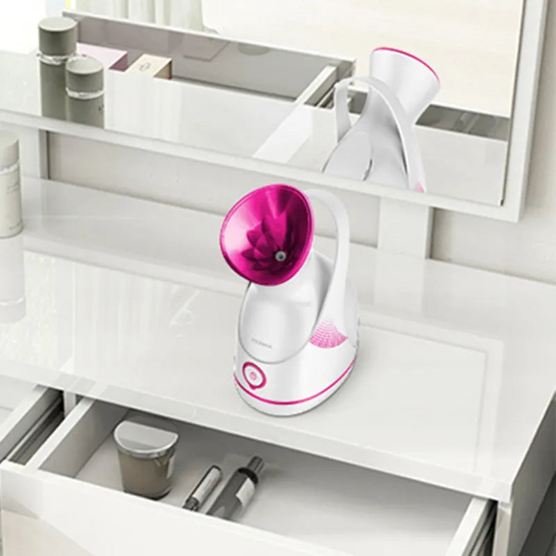White electric facial steamer with 55ml water tank and adjustable 150° nozzle for deep pore cleansing and aromatherapy
