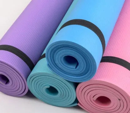 Red EVA fitness yoga mat with rolled edge showing thickness, alongside a blue mat and OPP storage bag.