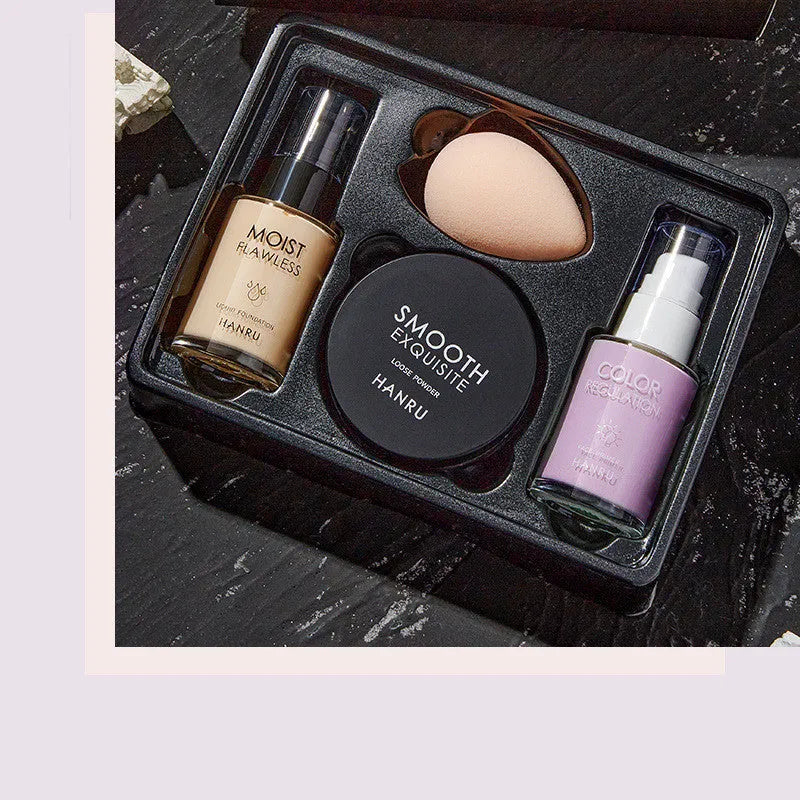 4-piece makeup set with liquid foundation isolation milk loose powder and beauty egg in ivory and green natural and purple colours