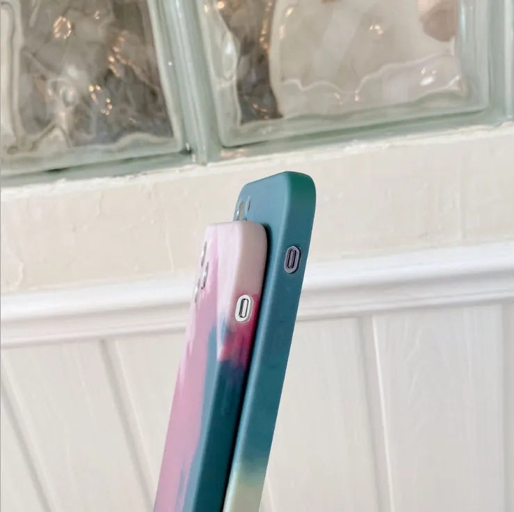 Abstract oil painting gradient geometric pattern on a soft blue silicone case for Apple iPhone.